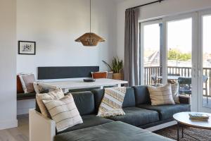 a living room with a couch and a table at Lokal Hotel Cape May in Cape May