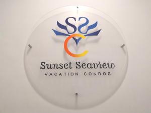 a sign for the sunset seafood vacation controllers logo at Sunset Seaview Vacation Condos @ IMAGO Shopping Mall in Kota Kinabalu