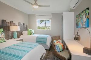 Cama ou camas em um quarto em Sea Breeze Beach House All Inclusive by Ocean Hotels