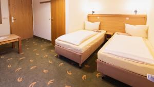 Ein Bett oder Betten in einem Zimmer der Unterkunft Landpension Minna
