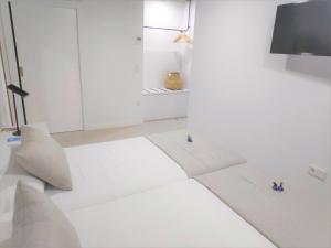 Postel nebo postele na pokoji v ubytování Sosiego Hostal de Mar