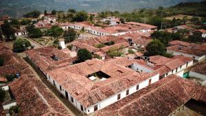 an aerial view of a village with roofs at Misia Custodia Hotel Boutique in Barichara