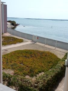 a view of the ocean from a balcony of a building at T3 VUE ETANG in Balaruc-les-Bains