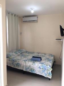 Un pat sau paturi într-o cameră la Pousada Alto de Junqueira