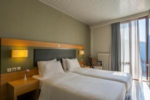 Postel nebo postele na pokoji v ubytování Kastalia Boutique Hotel