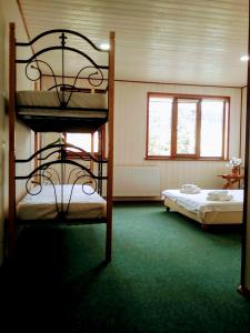 Postel nebo postele na pokoji v ubytování Hotel Galushko
