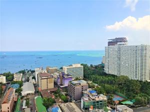 an aerial view of a city with buildings and the ocean at LLX Apartments at The Base condo in Pattaya Central