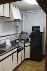 Kitchen o kitchenette sa NY Building 4th Floor, Guest House Ichibangai, Roo / Vacation STAY 55905