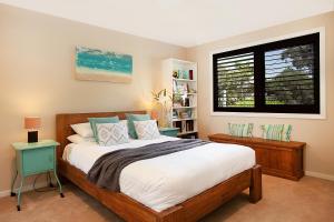 a bedroom with a bed and a window at Spacious Family Entertainer for Manly Retreat DUPLICATE in Sydney