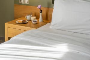Postel nebo postele na pokoji v ubytování Kastalia Boutique Hotel