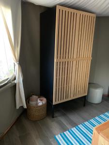 a room with a wooden partition with a basket and a window at Hostal de la Luz - Spa Holistic Resort in Tepoztlán +54 photos