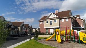 a playground with a slide in a residential neighborhood at Summerville Vacation Resort in Orlando