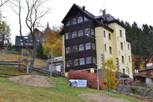 a large house on top of a hill at Rezydencja Na Skrócie in Karpacz