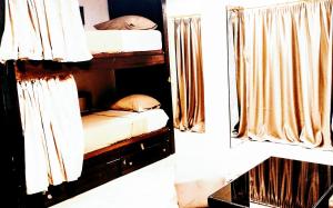 
A bunk bed or bunk beds in a room at Castle Hostel

