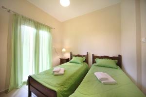 Postel nebo postele na pokoji v ubytování Sfakia Thea Apartments