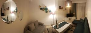 Televízia a/alebo spoločenská miestnosť v ubytovaní Fenia's Apartment