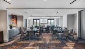 a large dining room with tables and chairs at Ayres Hotel San Diego South - Chula Vista in Chula Vista