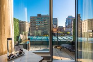 a large window with a view of a city at Hôtel Birks Montréal in Montreal