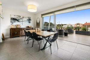 a dining room with a table and chairs at Saltwater Apartment Sorrento in Sorrento