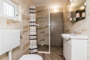 Kúpeľňa v ubytovaní Apartment LORO