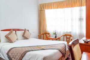 Cama o camas de una habitación en Draco Cat Ba QK3 Hotel