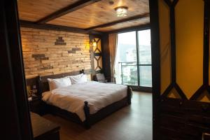 Postel nebo postele na pokoji v ubytování Youngquan HOTEL