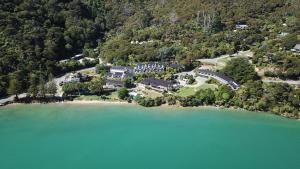 an aerial view of a house on an island in the water at The Portage Resort in Portage