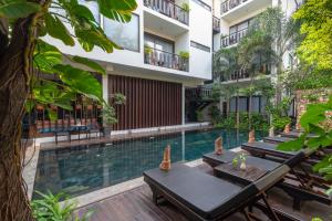 a hotel with a swimming pool and a resort at King Rock Boutique Hotel in Siem Reap