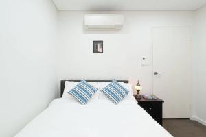 En eller flere senger på et rom på City Stay apartment, Darling Harbour, Sydney