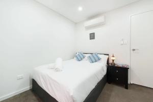 Cama ou camas em um quarto em City Stay apartment, Darling Harbour, Sydney