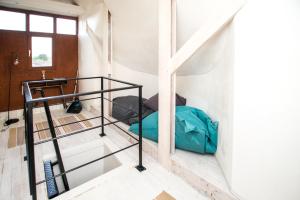 a room with a bunk bed and a staircase at De Lievensmolen in Damme