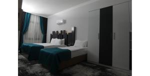 Ένα ή περισσότερα κρεβάτια σε δωμάτιο στο Plaza Hotel Izmir