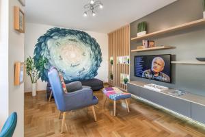 A television and/or entertainment centre at VortexLuxApatman