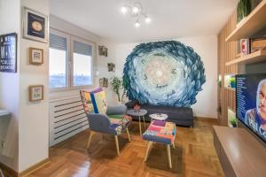 A seating area at VortexLuxApatman
