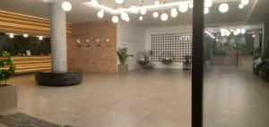 a lobby with a large lobby with potted plants at Proud Khaoyai in Pak Chong +51 photos