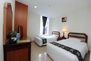 Postel nebo postele na pokoji v ubytování Palm Inn Ampang Point