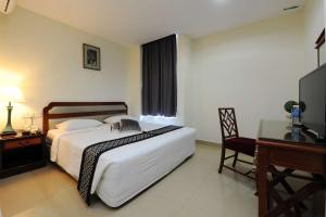 Postel nebo postele na pokoji v ubytování Palm Inn Ampang Point