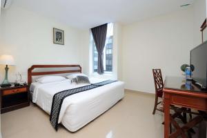 Postel nebo postele na pokoji v ubytování Palm Inn Ampang Point