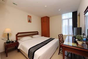 Postel nebo postele na pokoji v ubytování Palm Inn Ampang Point