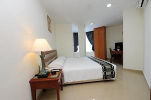 Postel nebo postele na pokoji v ubytování Palm Inn Ampang Point