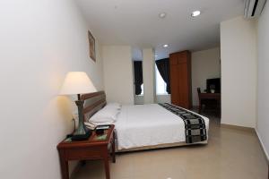 Postel nebo postele na pokoji v ubytování Palm Inn Ampang Point