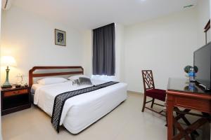 Postel nebo postele na pokoji v ubytování Palm Inn Ampang Point