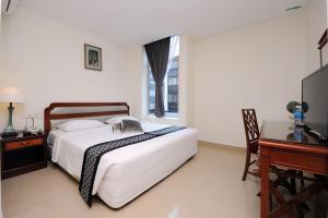 Postel nebo postele na pokoji v ubytování Palm Inn Ampang Point