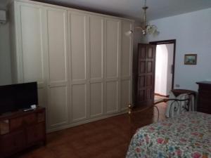 Postel nebo postele na pokoji v ubytování B&B Villa Le Palme Scalea