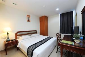 Postel nebo postele na pokoji v ubytování Palm Inn Ampang Point
