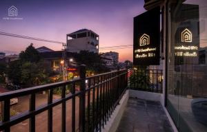 a view from a balcony of a building at night at SYRI Boutique Guesthouse Restaurant & Cafe in Vientiane