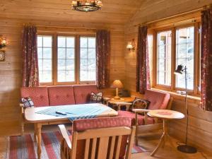 a dining room with a table in a cabin at 4 person holiday home in olden in Olden