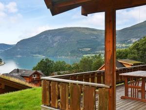 a porch of a cabin with a view of a lake at Holiday home Olden V in Olden
