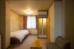 Letto o letti in una camera di Kurobe View Hotel