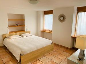 Кровать или кровати в номере Appartamento ai Ronchi